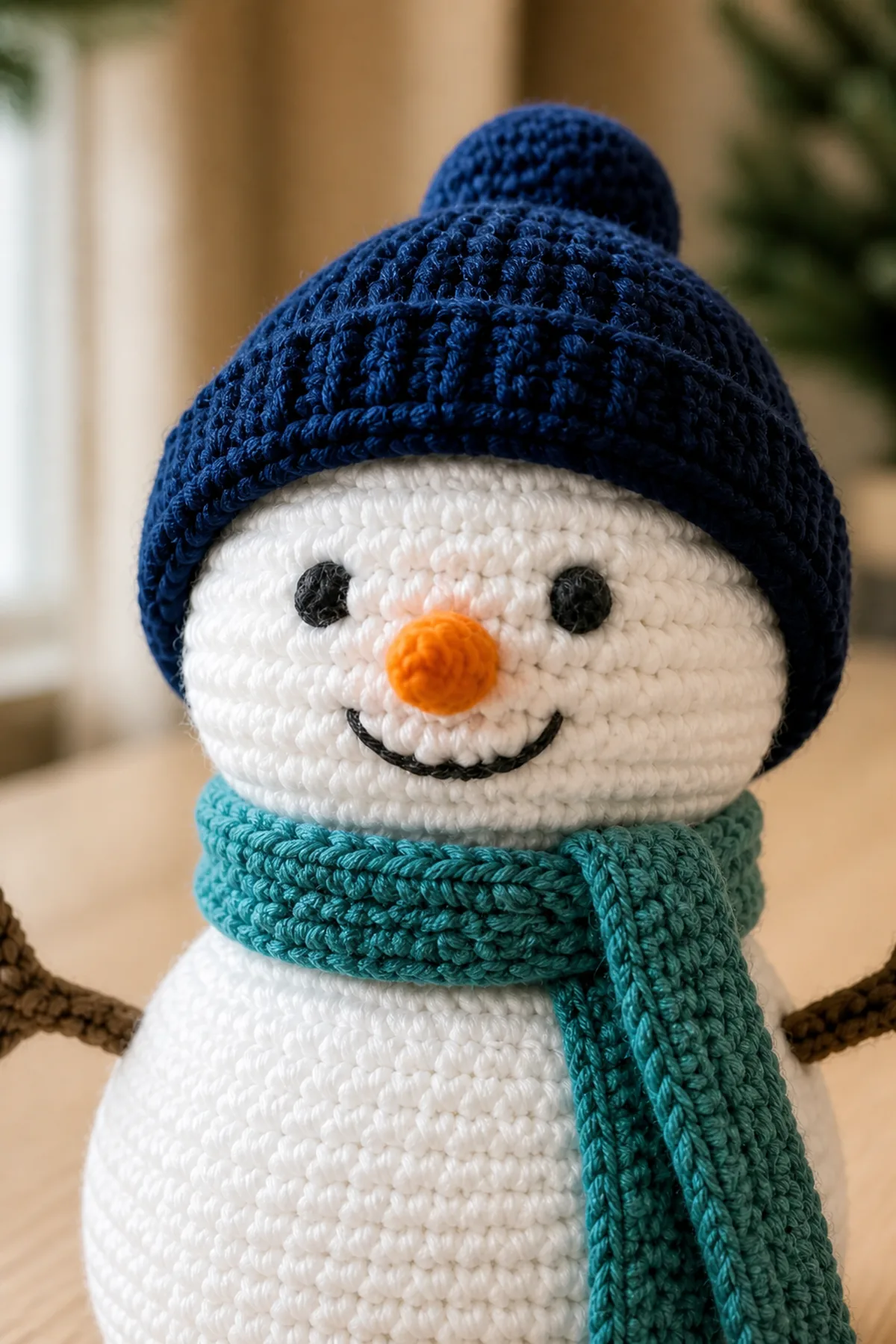 Close-up of crochet stitches and finishing details in white, navy, teal, orange, brown, and charcoal