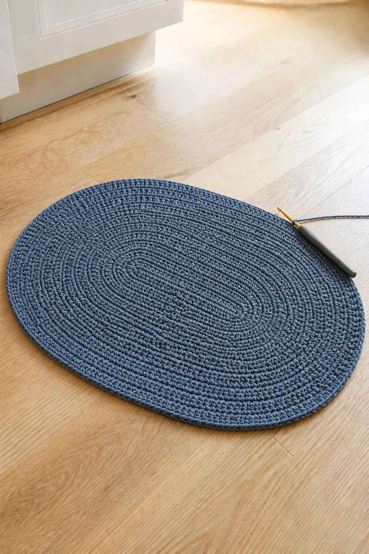 Later construction step for the slate blue oval pet bowl mat with cream border