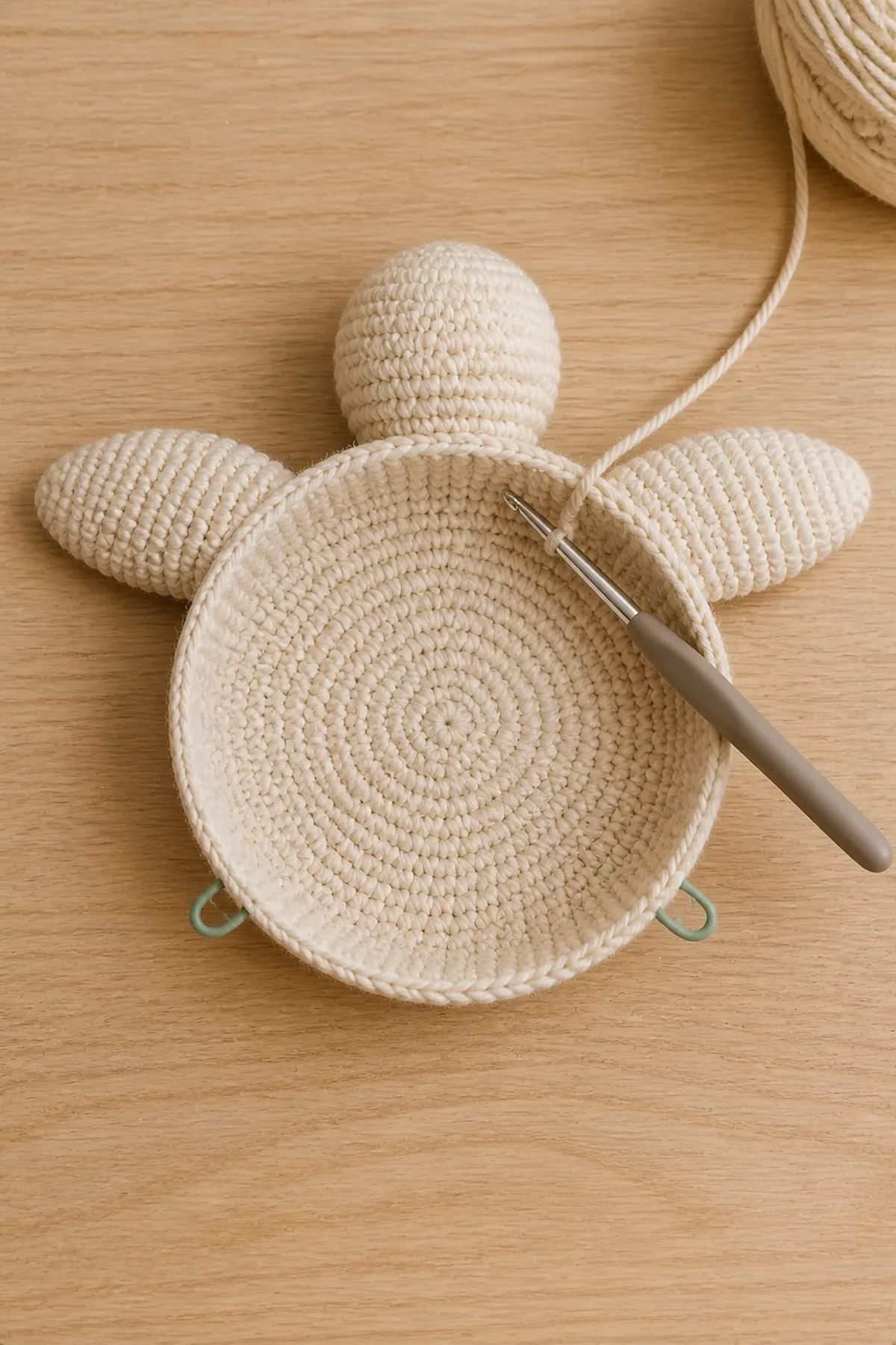 Cream crochet turtle underside with head and flippers integrated at marked body positions